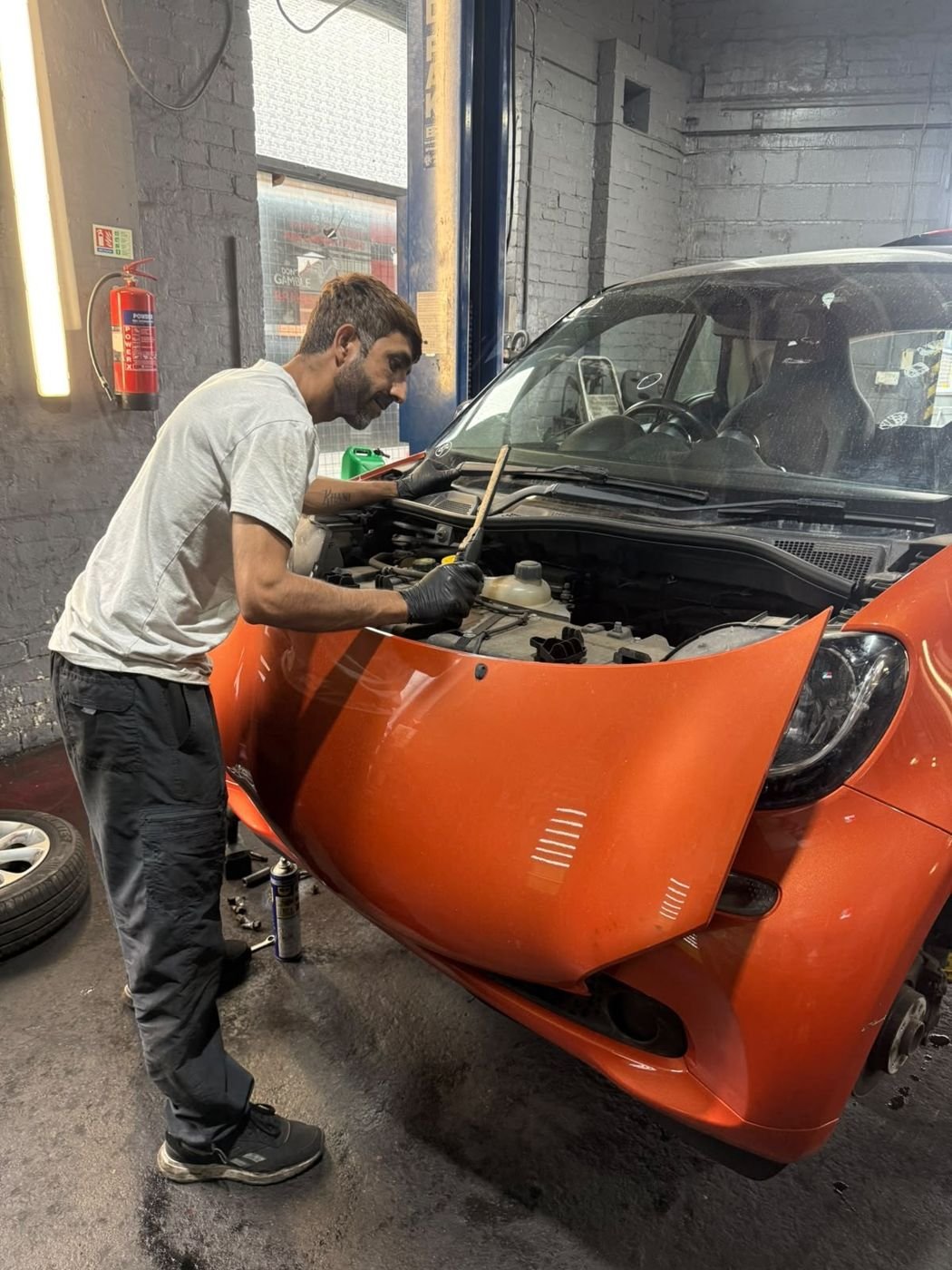 Mechanic carrying out an on-site repair in Sheffield